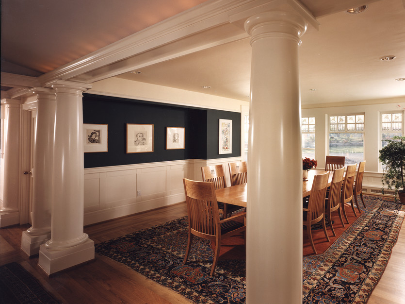 Columns and custom wainscotting adorn this beautiful dining room