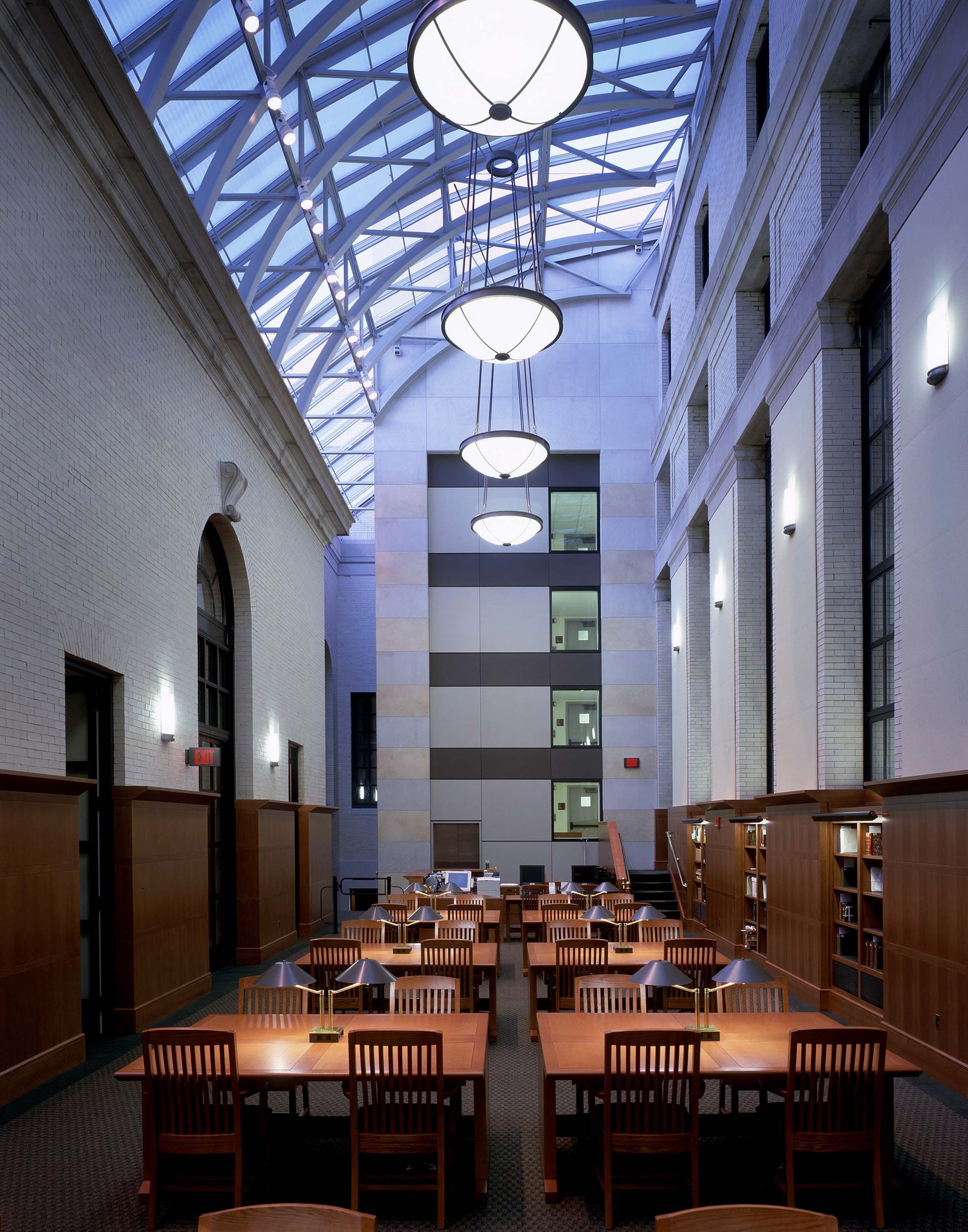 Another view of the high ceilings in the entryway. This space work so effectively. There is the grand atrium paired with the warm wood wall and furniture. The architects did an excellent job making this job timeless and so fitting for the Harvard community.