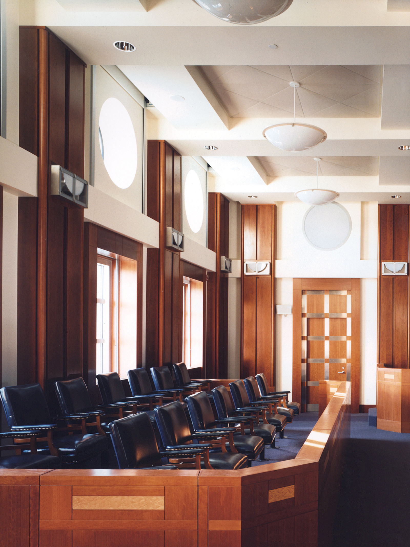 This gorgeous courtroom a jury box with wood inlay, wall and column paneling, judges chamber door in cherry and metal inlay. This project was one of our earlier technical projects and it truly showcases the talented craftsmen we have in our shop.