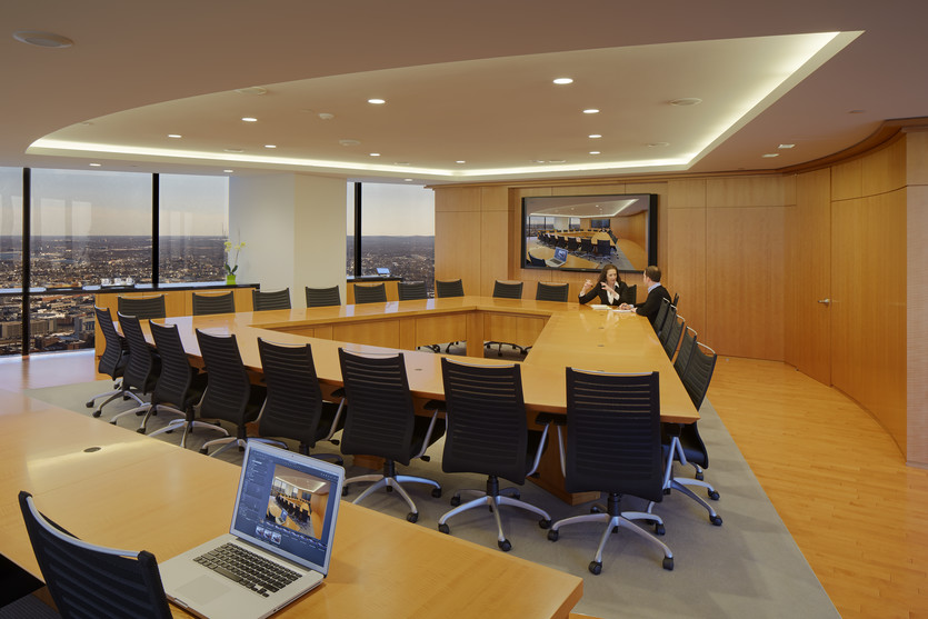 A beautiful custom conference table with matching wall paneling make this room the perfect combination of form and function in sync.