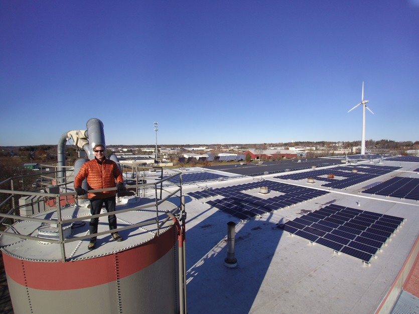 Mark Richey atop one of our silos for our biomass furnace. In the background out new solar array and our wind turbine. These three combined, make MRW one fo the greenest manufacturing companies in the country