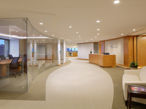 Glass and wood adorn this modern Boston space. This timeless space was designed to always look current. 