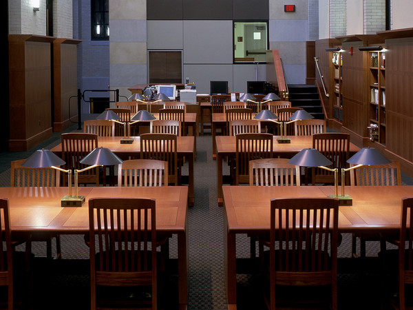 MRW built these work tables for the Widener Library at Harvard. The warm wood paneling and the custom wood furniture are a perfect combination with the cooler grey walls