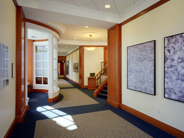 A beautiful curved wall enhances this space. The quality and craftsmanship we put in our trim and wall panels will stand the test of time at Harvard.