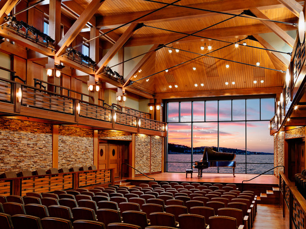 The glass wall rises behind the stage to reveal a breath-taking stretch of the Atlantic Ocean.