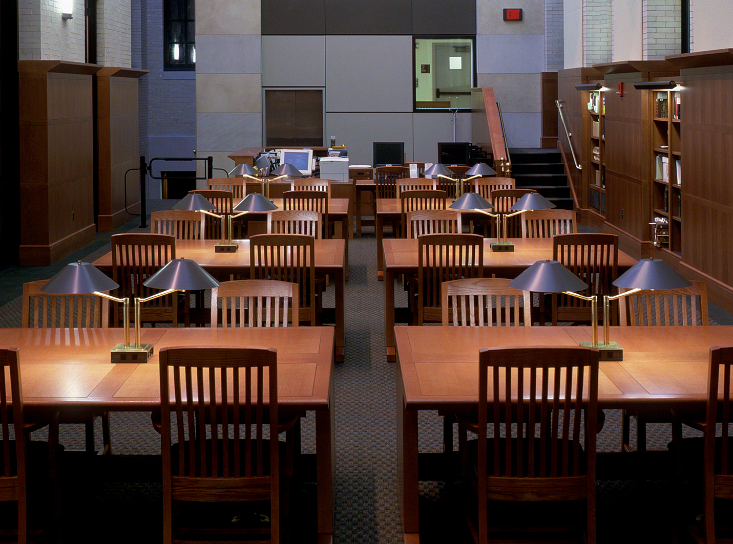 MRW built these work tables for the Widener Library at Harvard. The warm wood paneling and the custom wood furniture are a perfect combination with the cooler grey walls