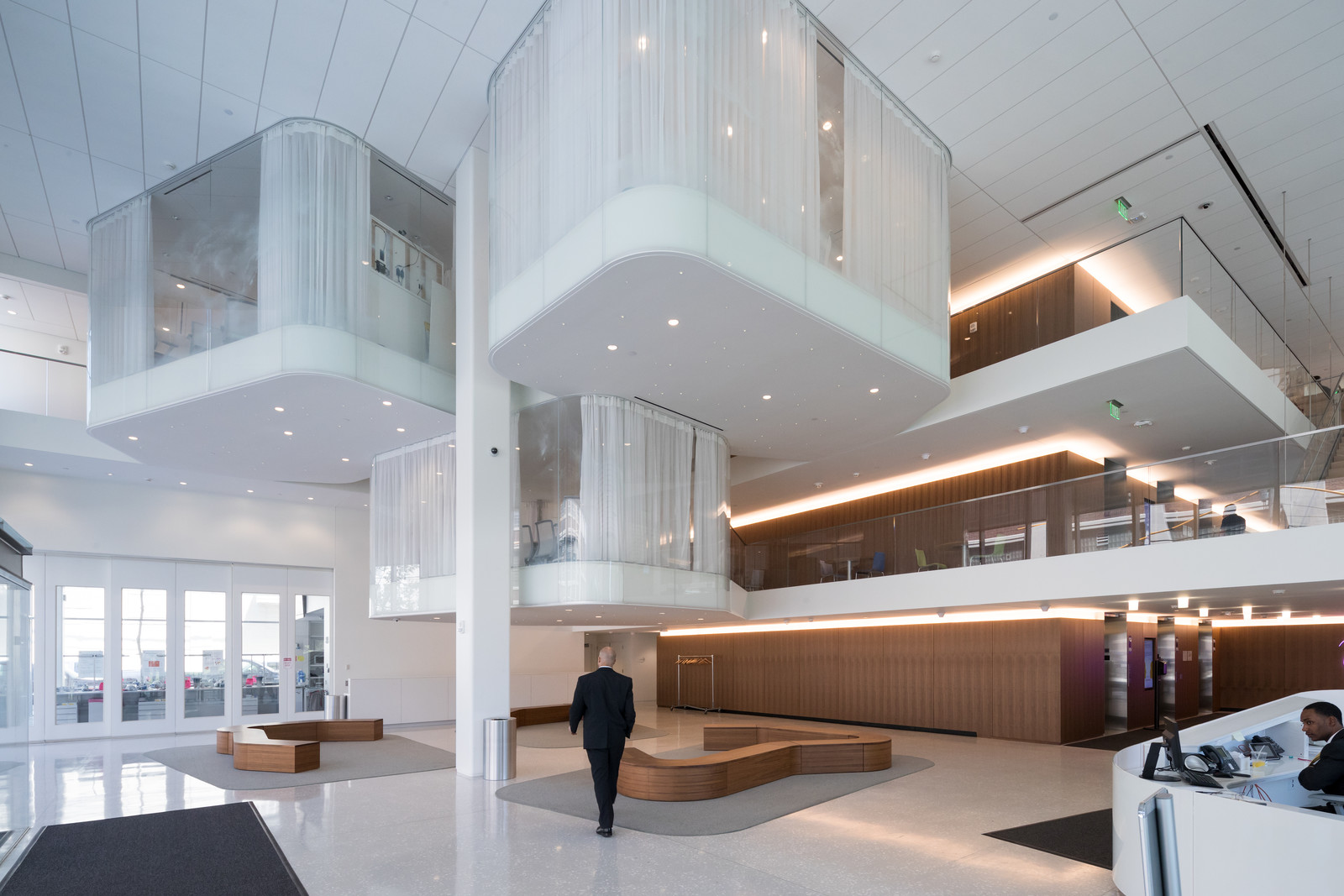 This light-filled atrium incorporates paneling and benches crafted from European rift white oak and walnut. This lobby designed by Architect Toshiko Mori is simple but elegant.