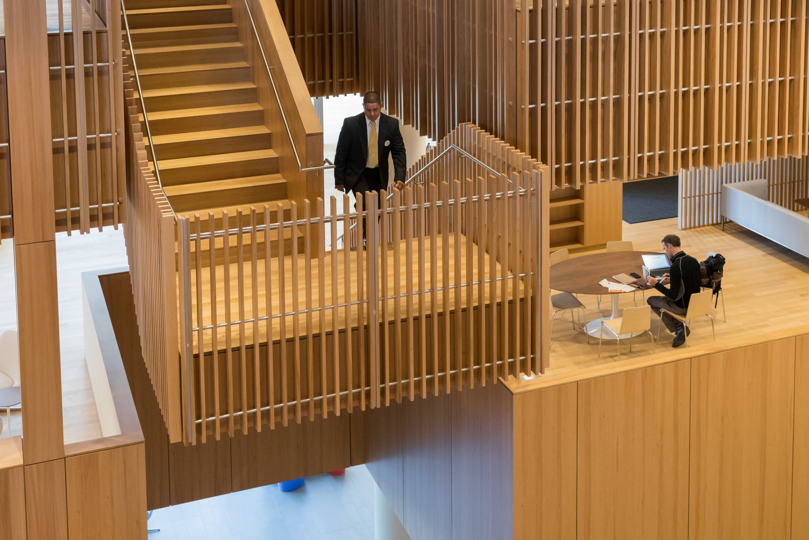 A birdseye view of one of the many integral stairs that work so well on the Novartis campus. This stair looks out over the Atrium. The space is filled with many different types of breakout spaces, to foster collaboration.