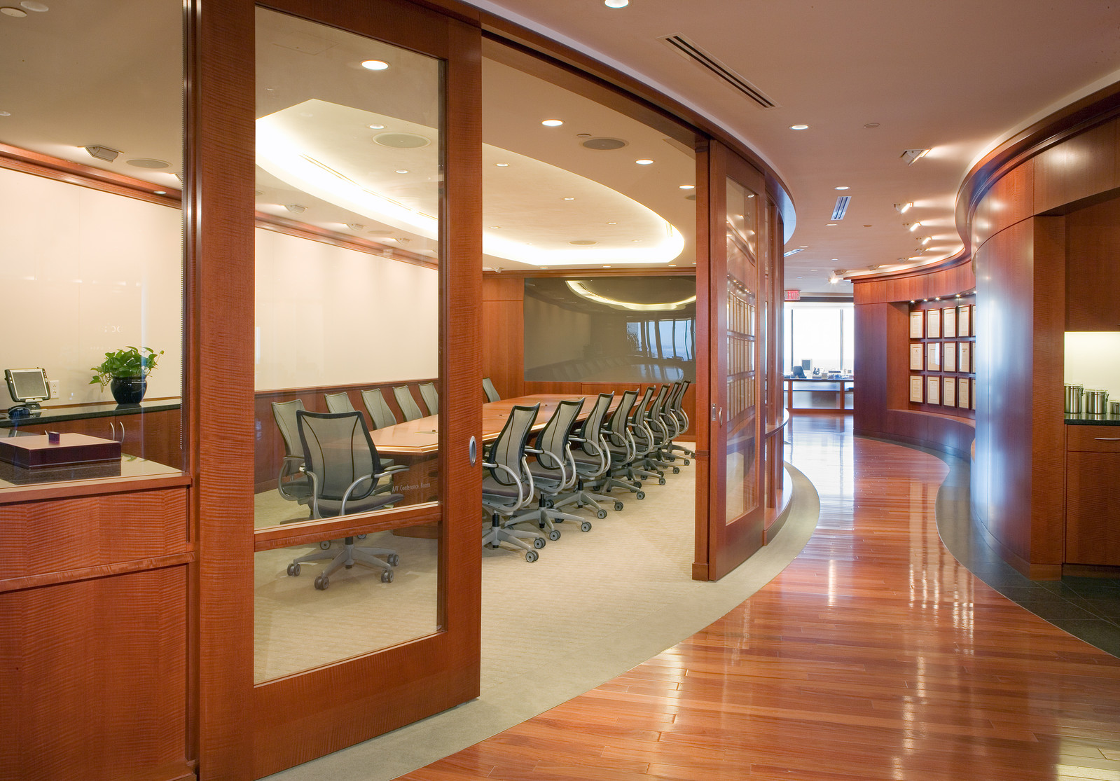 This beautiful curved conference room has MRW touches on it. From the curved, sliding doors,the conference table, the wainscotting and the servery these pieces combined make the room.  