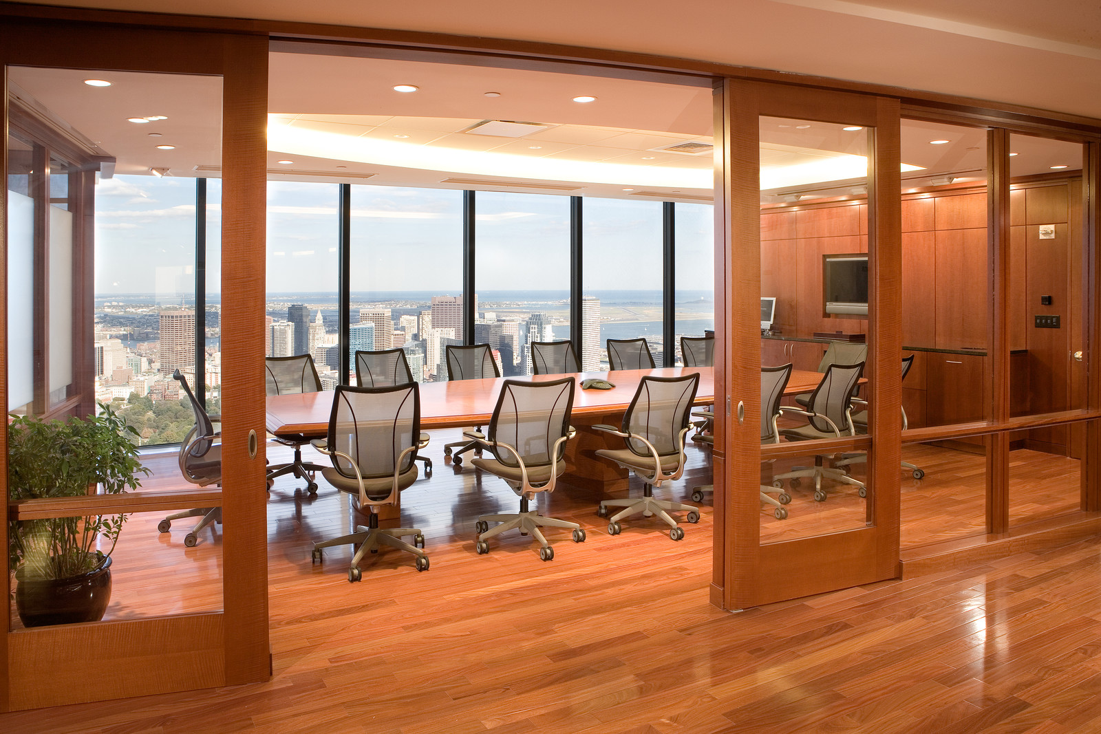 The sliding doors, conference table, wall panels and built-in credenza make this conference room a real centerpiece.