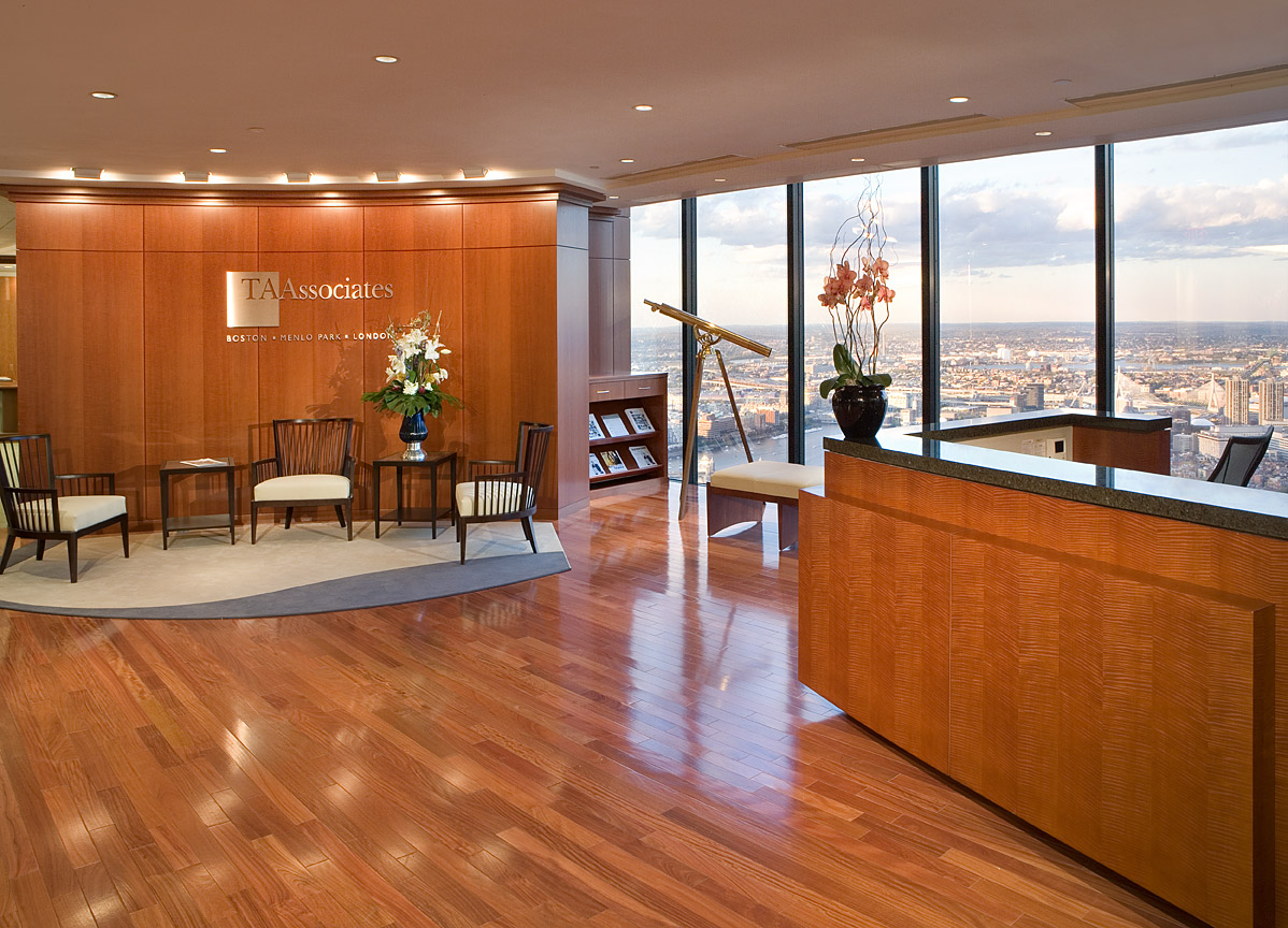 Custom wood panels and reception desk highlight this gorgeous reception area