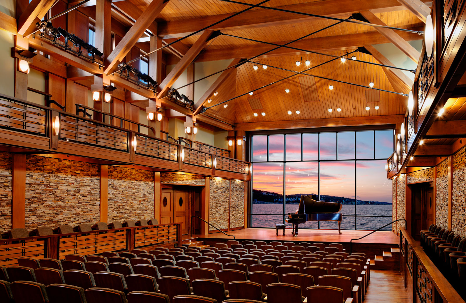 The glass wall rises behind the stage to reveal a breath-taking stretch of the Atlantic Ocean.