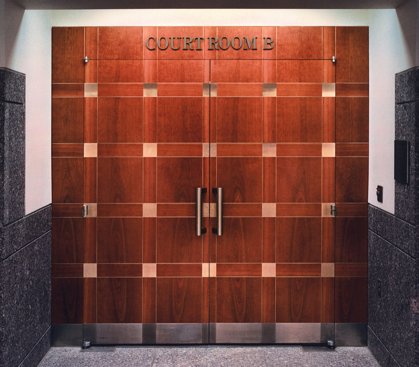 These doors were made out of 1/4 cherry wood with inlay. Today they still look current and the three combined are quite unique.  