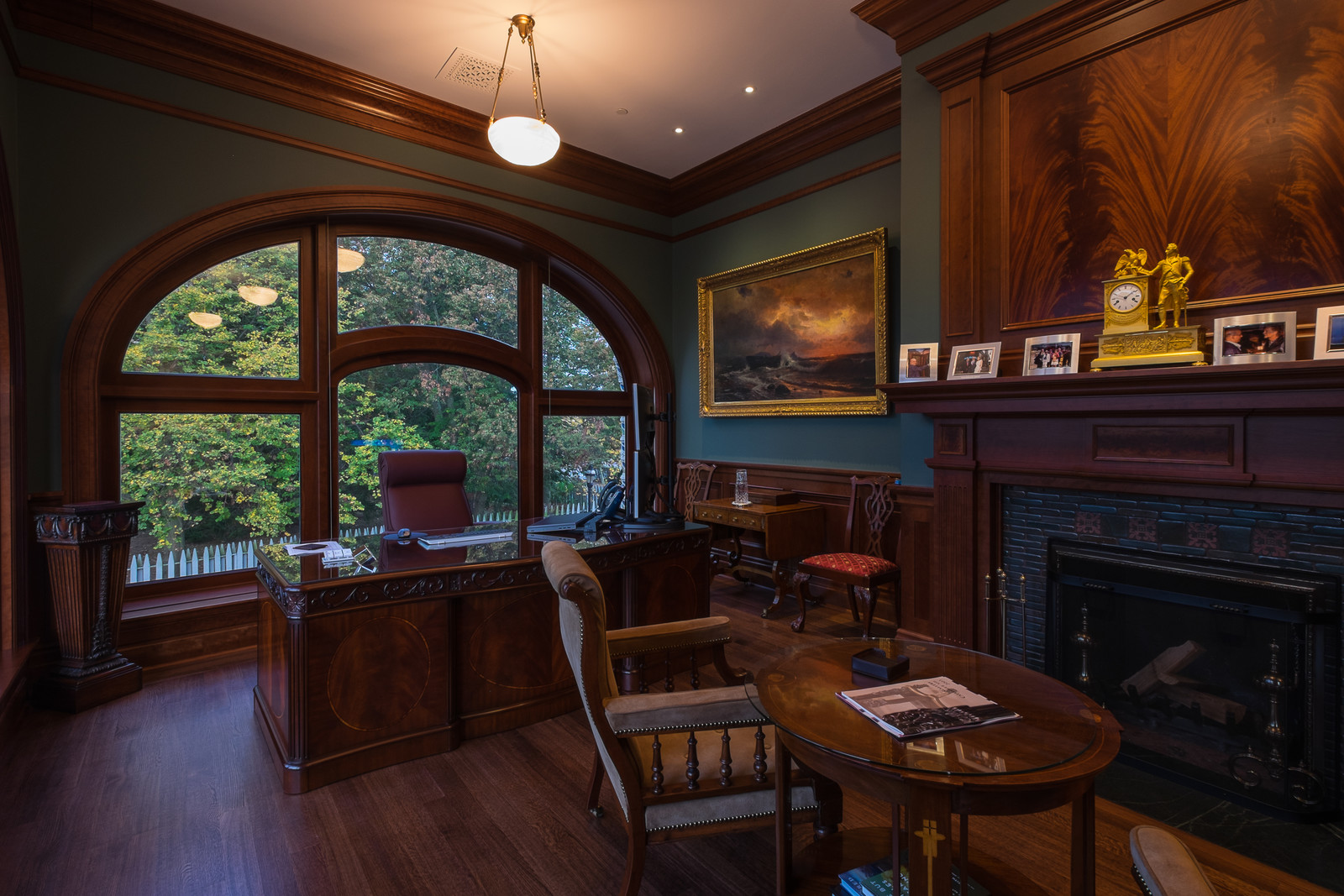 This private office is one of our most beautiful works in wood. The wood mantel and trim fit seamlessly with the wood furniture.